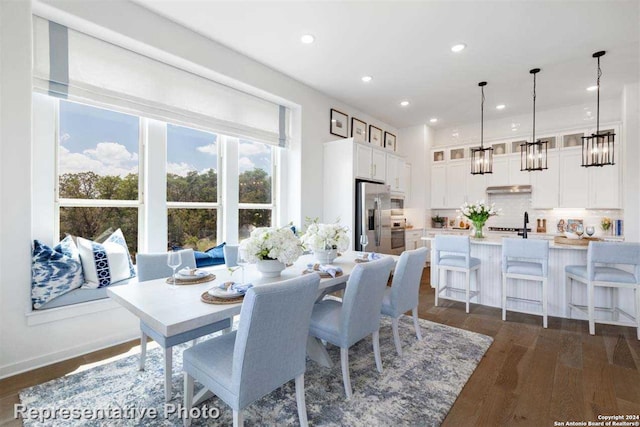 dining room with dark hardwood / wood-style flooring