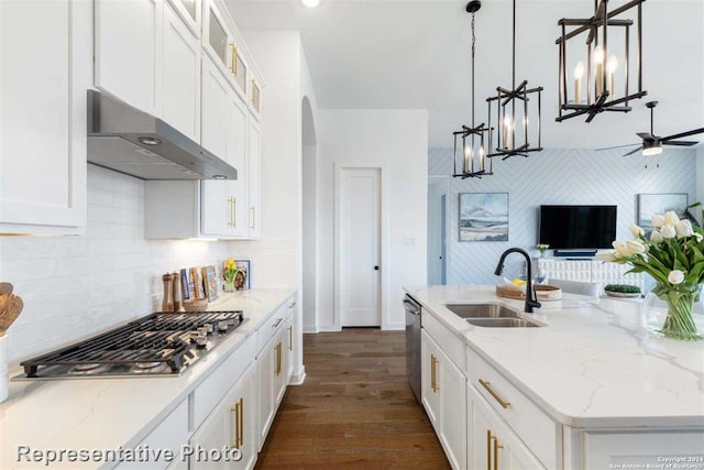 kitchen with a kitchen island with sink, sink, decorative light fixtures, stainless steel appliances, and extractor fan