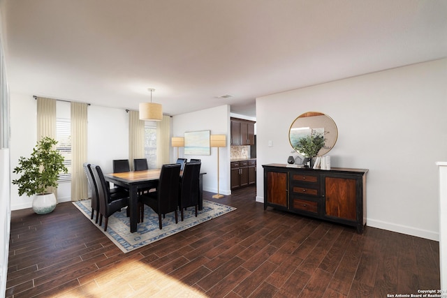 dining room with dark hardwood / wood-style floors