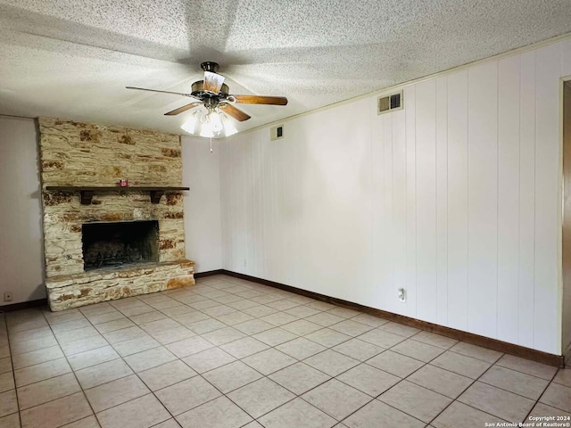 15618 Elks Pass St, San Antonio, TX 78232 - unfurnished living room featuring ceiling fan, a fireplace, a textured ceiling, and baseboards
