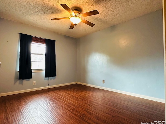 15618 Elks Pass St, San Antonio, TX 78232 - unfurnished room featuring dark wood-style flooring, a textured ceiling, a ceiling fan, and baseboards