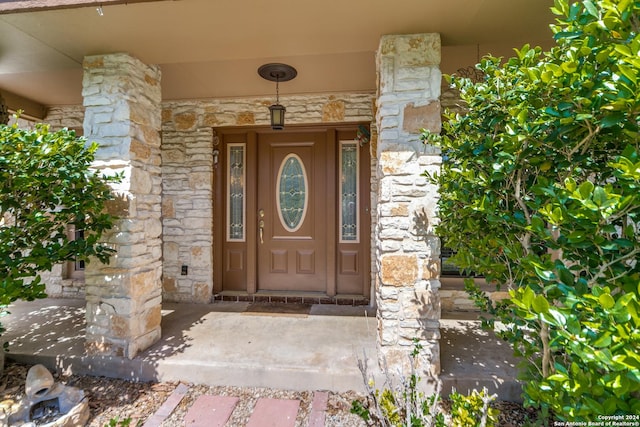 15618 Elks Pass St, San Antonio, TX 78232 - property entrance featuring stone siding and a porch