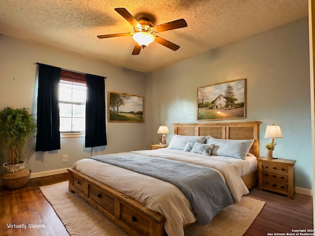 15618 Elks Pass St, San Antonio, TX 78232 - bedroom featuring a textured ceiling, baseboards, wood finished floors, and ceiling fan