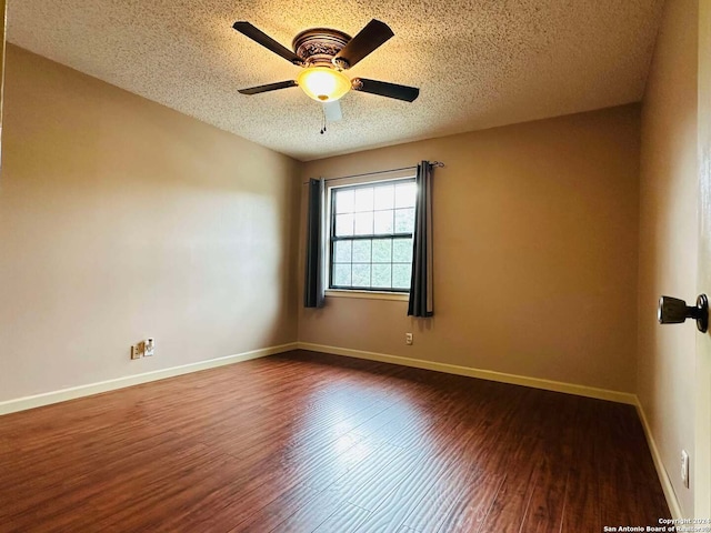 15618 Elks Pass St, San Antonio, TX 78232 - unfurnished room with dark wood-type flooring, a textured ceiling, ceiling fan, and baseboards