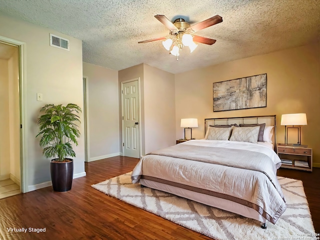 15618 Elks Pass St, San Antonio, TX 78232 - bedroom with wood finished floors, a textured ceiling, baseboards, and a ceiling fan