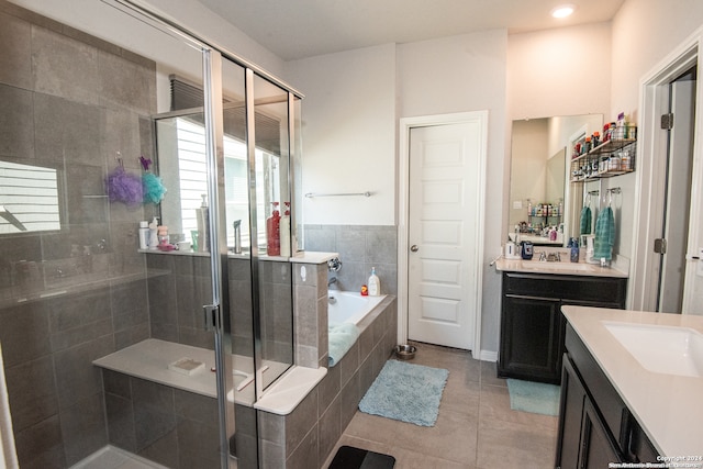 bathroom featuring tile patterned floors, vanity, and separate shower and tub