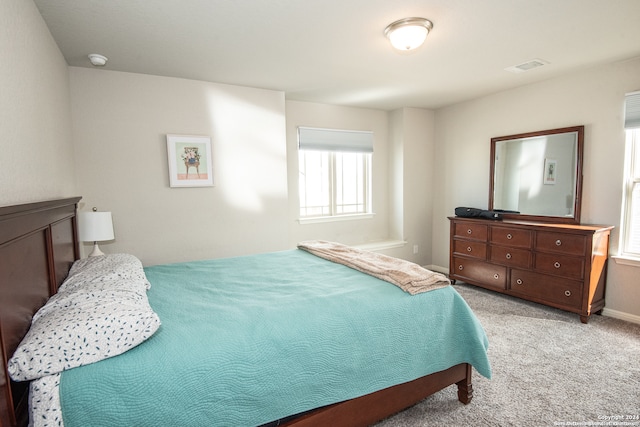 bedroom with light carpet