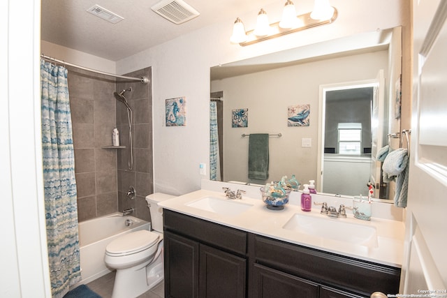 full bathroom featuring tile patterned flooring, vanity, toilet, and shower / bath combo with shower curtain