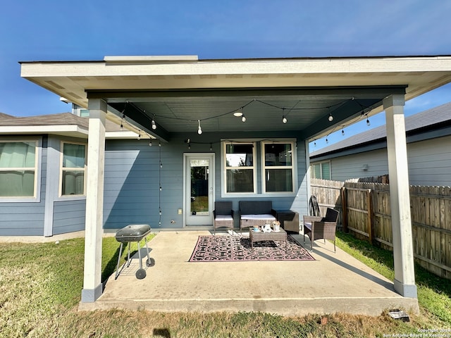 rear view of house featuring a patio and an outdoor hangout area