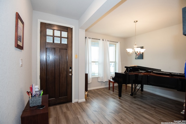 entryway featuring dark hardwood / wood-style floors and a notable chandelier