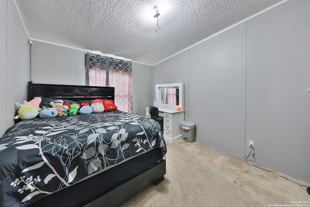 carpeted bedroom with lofted ceiling, a textured ceiling, and ornamental molding