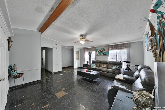 living room with lofted ceiling, ceiling fan, and a textured ceiling