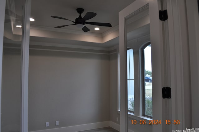 interior space featuring ceiling fan and crown molding