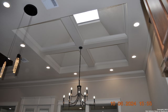 details with beam ceiling, crown molding, and a notable chandelier