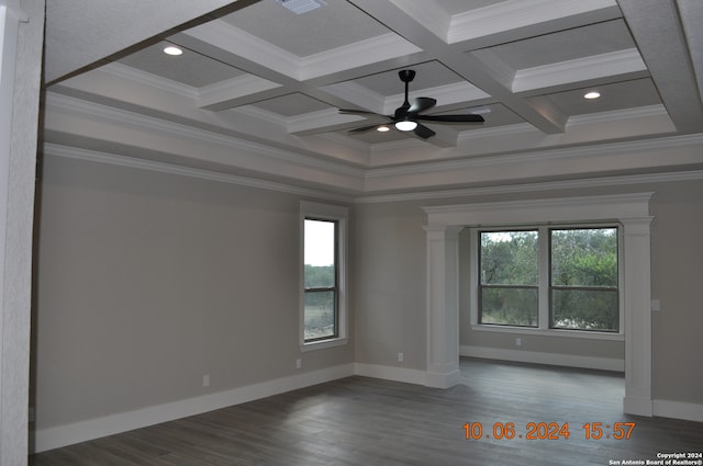 spare room with beamed ceiling, crown molding, dark wood-type flooring, and coffered ceiling