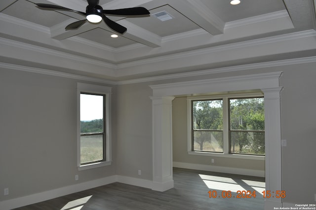 unfurnished room with ornamental molding, a wealth of natural light, and ornate columns