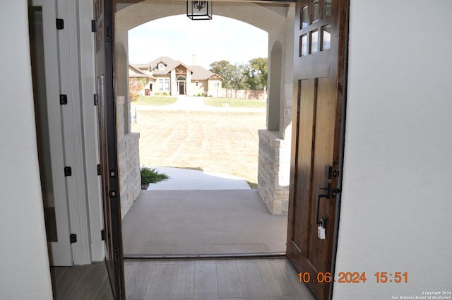 doorway to outside featuring wood-type flooring