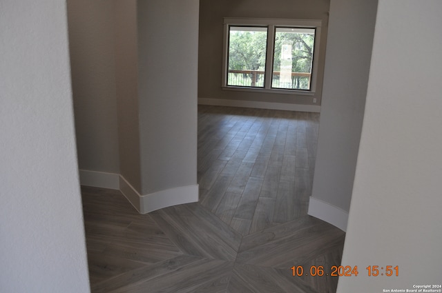 empty room with dark hardwood / wood-style floors