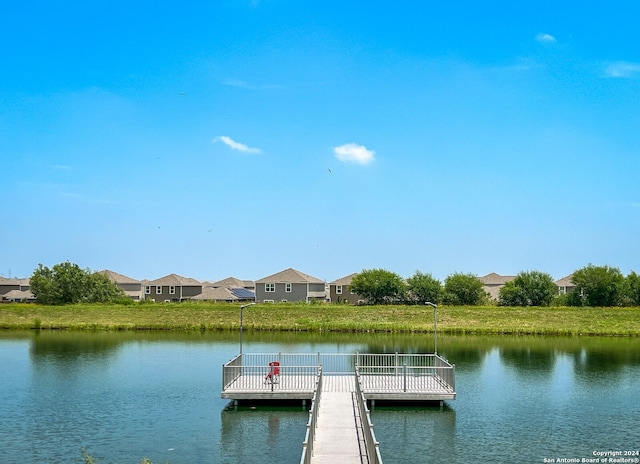 dock area featuring a water view