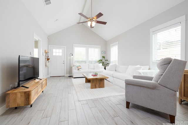 living room featuring light wood-type flooring, high vaulted ceiling, and ceiling fan