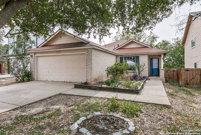 ranch-style home with a garage