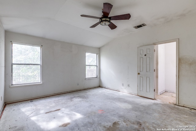 spare room with ceiling fan and vaulted ceiling