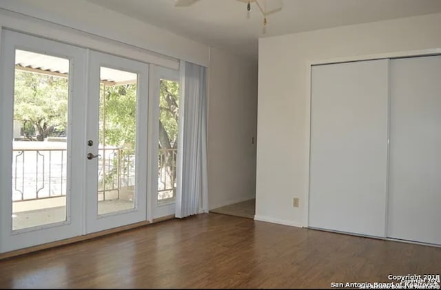 doorway to outside with ceiling fan, plenty of natural light, dark hardwood / wood-style floors, and french doors