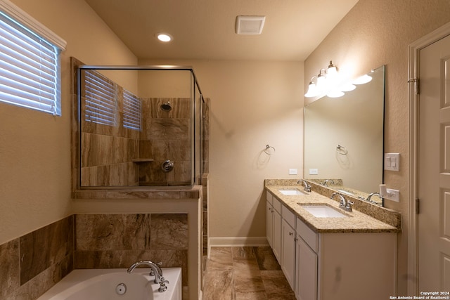 bathroom featuring separate shower and tub and vanity