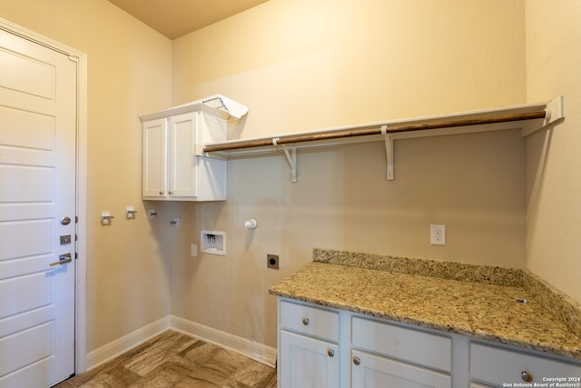 washroom with hookup for an electric dryer, gas dryer hookup, cabinets, and washer hookup