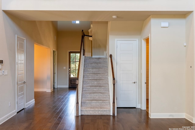 hall with dark hardwood / wood-style floors