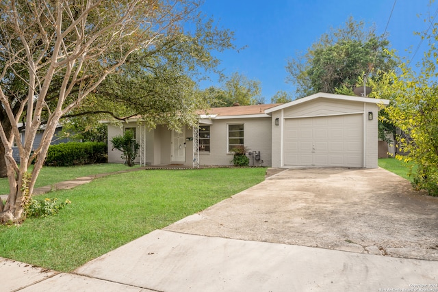 single story home with a front yard and a garage