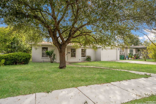 view of front of home featuring a garage and a front lawn