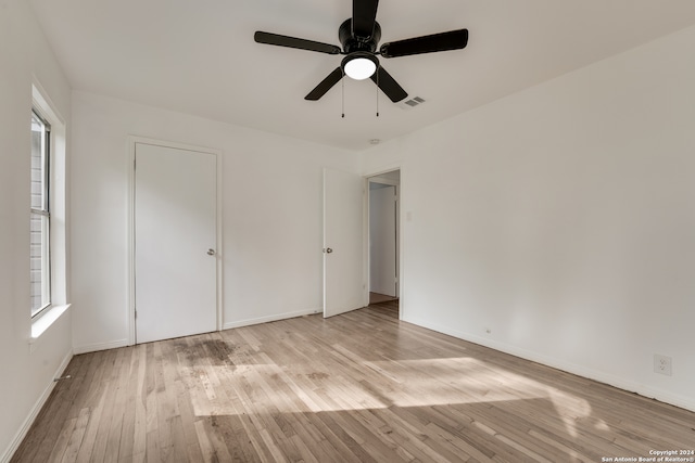 unfurnished bedroom featuring ceiling fan and light wood-type flooring