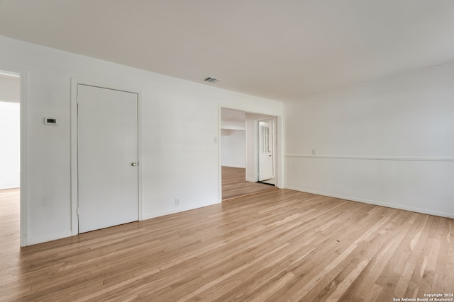 empty room with light hardwood / wood-style floors