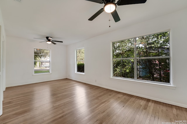 unfurnished room featuring light hardwood / wood-style floors and ceiling fan