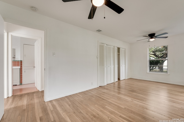 unfurnished room with ceiling fan and light hardwood / wood-style flooring