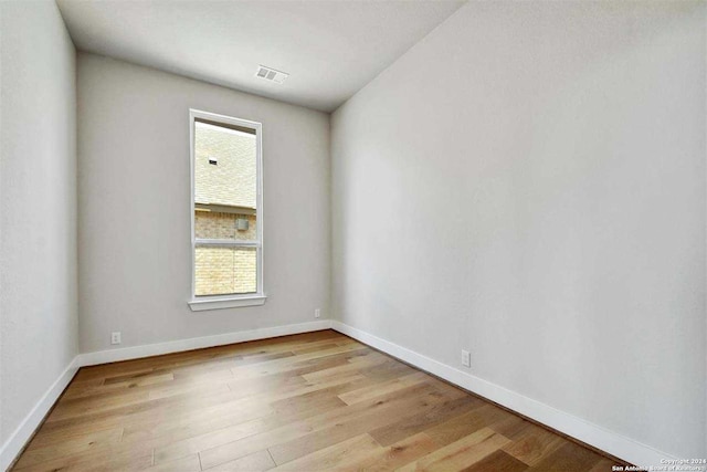 unfurnished room featuring light hardwood / wood-style floors