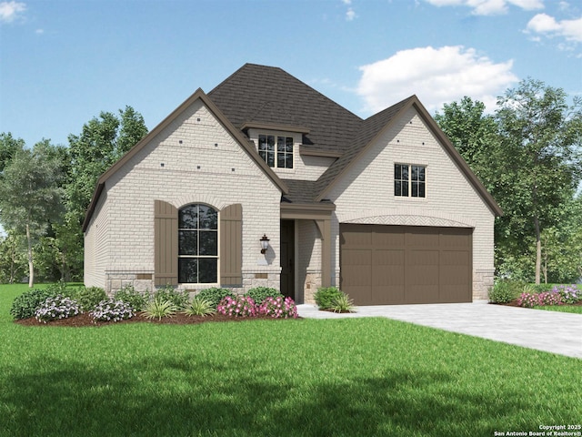 view of front facade with a garage and a front yard