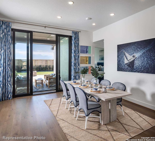 dining space featuring hardwood / wood-style flooring