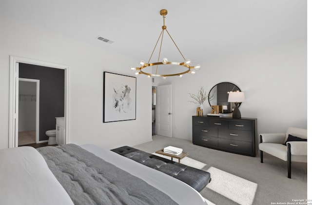 bedroom with light carpet and a chandelier