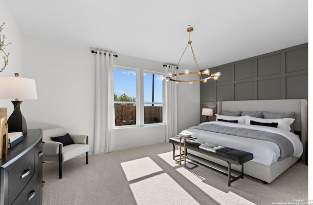 bedroom with light colored carpet and an inviting chandelier