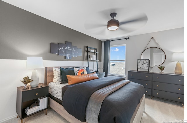 bedroom with light carpet and ceiling fan