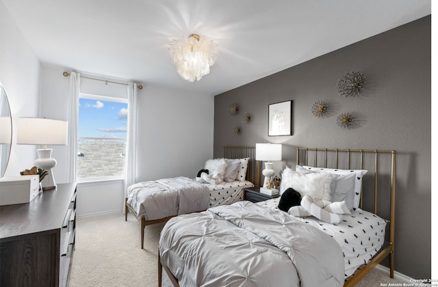 8156 Smithers Ave, San Antonio, TX 78252 - bedroom with light carpet and a chandelier
