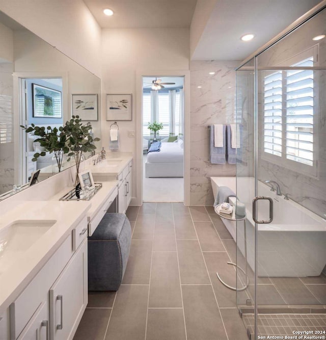 bathroom with vanity, a shower with shower door, tile patterned floors, and ceiling fan