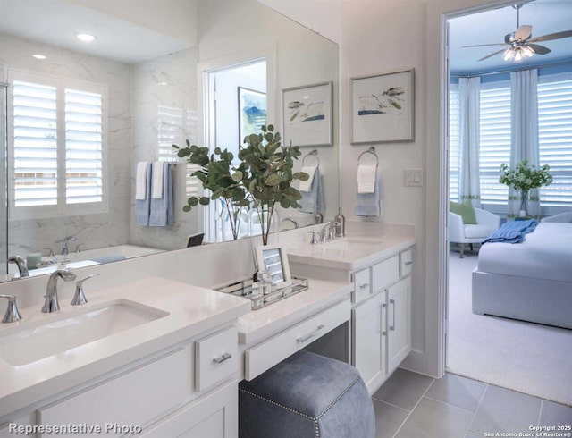 bathroom with vanity, plenty of natural light, tile patterned floors, and ceiling fan