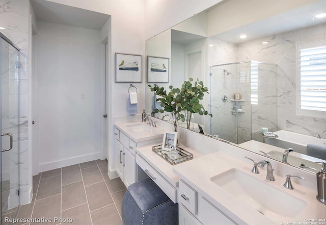 bathroom with plus walk in shower, vanity, and tile patterned floors