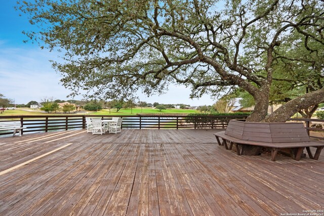 wooden terrace with a water view