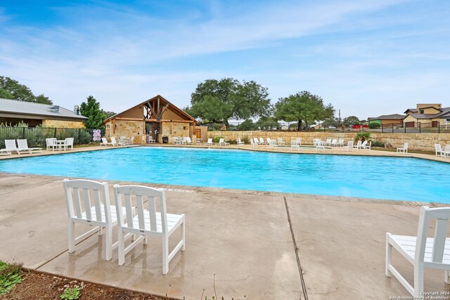 view of pool featuring a patio