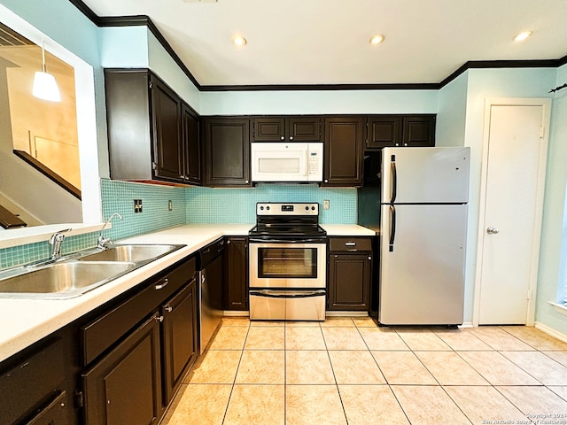 kitchen with pendant lighting, sink, crown molding, decorative backsplash, and stainless steel appliances