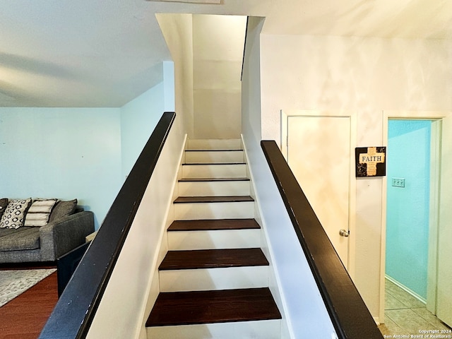 stairway featuring hardwood / wood-style flooring